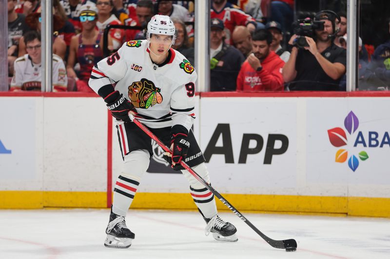 Oct 7, 2025; Sunrise, Florida, USA; Chicago Blackhawks right wing Ilya Mikheyev (95) moves the puck against the Florida Panthers during the first period at Amerant Bank Arena. Mandatory Credit: Sam Navarro-Imagn Images