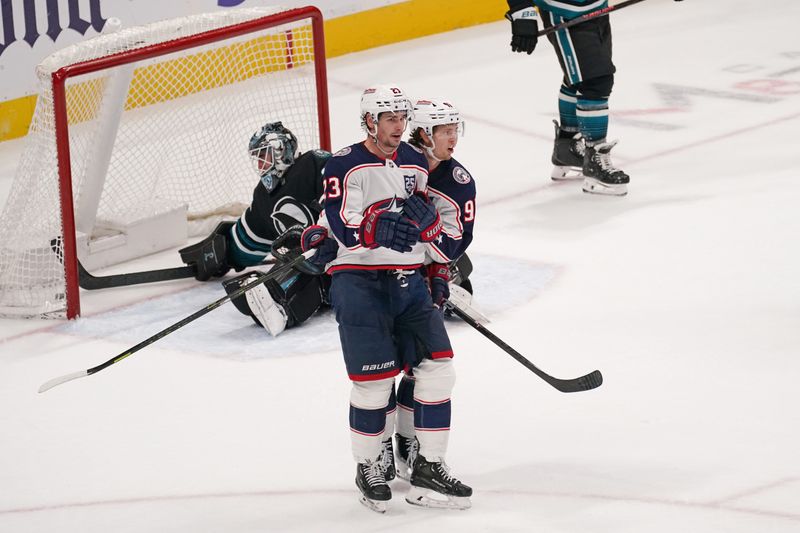 Jan 6, 2026; San Jose, California, USA;  Columbus Blue Jackets center Sean Monahan (23) celebrates with center Adam Fantilli (19) after scoring a goal against San Jose Sharks goaltender Alex Nedeljkovic (33) in the third period at SAP Center at San Jose. Mandatory Credit: David Gonzales-Imagn Images