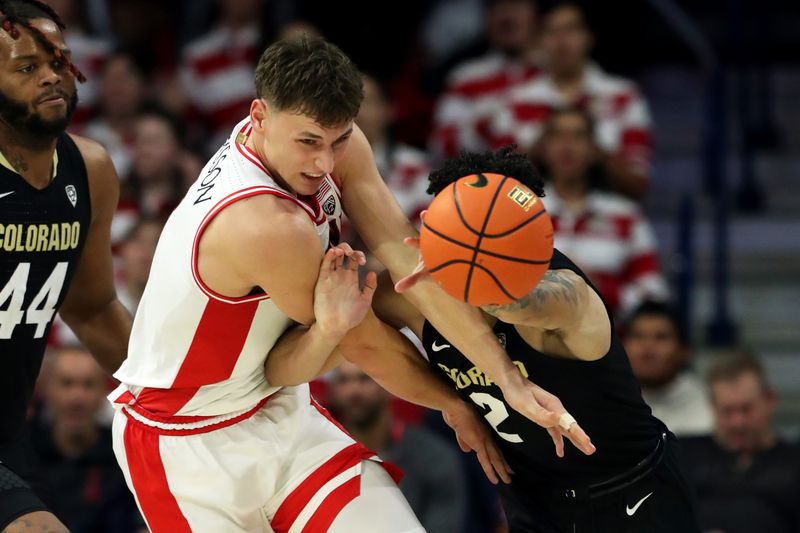 Jan 4, 2024; Tucson, Arizona, USA; Arizona Wildcats guard Pelle Larsson (3) runs after a loose ball against Colorado Buffaloes guard KJ Simpson (2) during the second half at McKale Center. Mandatory Credit: Zachary BonDurant-USA TODAY Sports