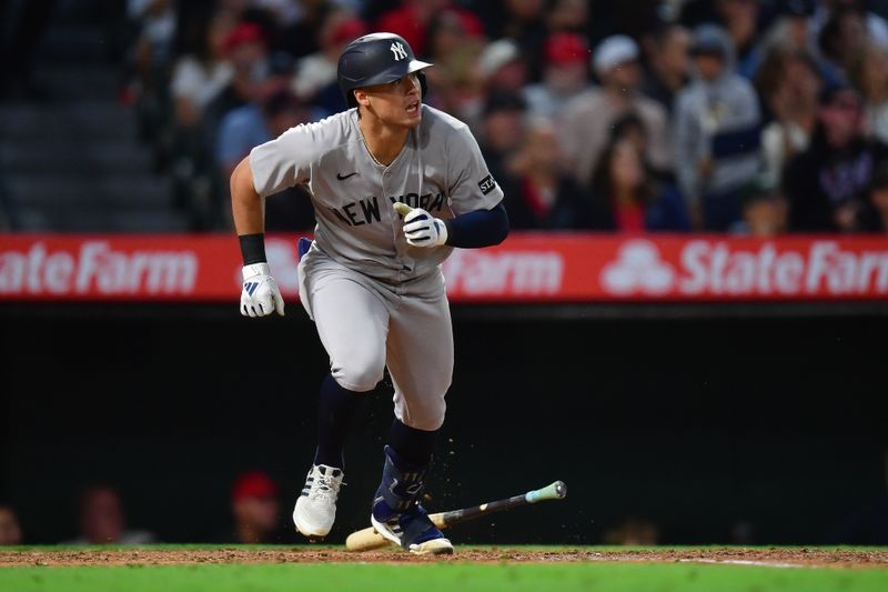 May 27, 2025; Anaheim, California, USA; New York Yankees shortstop Anthony Volpe (11) runs after hitting an RBI single against the Los Angeles Angels during the sixth inning at Angel Stadium. Mandatory Credit: Gary A. Vasquez-Imagn Images