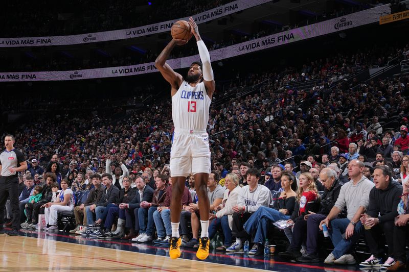 PHILADELPHIA, PA - MARCH 27: Paul George #13 of the LA Clippers shoots a three point basket during the game against the Philadelphia 76ers on March 27, 2024 at the Wells Fargo Center in Philadelphia, Pennsylvania NOTE TO USER: User expressly acknowledges and agrees that, by downloading and/or using this Photograph, user is consenting to the terms and conditions of the Getty Images License Agreement. Mandatory Copyright Notice: Copyright 2024 NBAE (Photo by Jesse D. Garrabrant/NBAE via Getty Images)