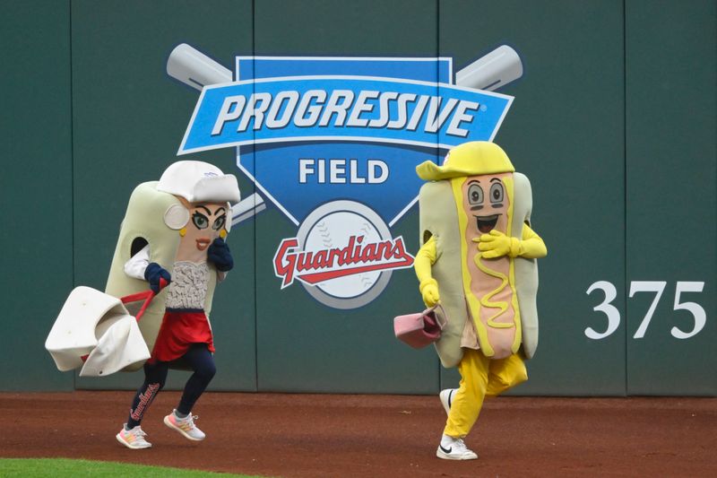 Jun 4, 2024; Cleveland, Ohio, USA; Hot dog mascots race during a game between the Cleveland Guardians and the Kansas City Royals at Progressive Field. Mandatory Credit: David Richard-USA TODAY Sports