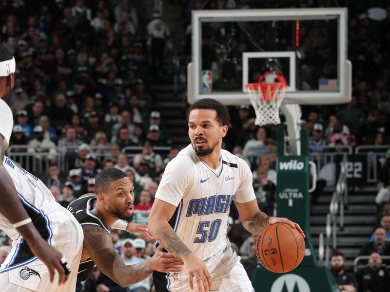 MILWAUKEE, WI - JANUARY 15:  Cole Anthony #50 of the Orlando Magic handles the ball during the game against the Milwaukee Bucks on January 15, 2025 at Fiserv Forum Center in Milwaukee, Wisconsin. NOTE TO USER: User expressly acknowledges and agrees that, by downloading and or using this Photograph, user is consenting to the terms and conditions of the Getty Images License Agreement. Mandatory Copyright Notice: Copyright 2025 NBAE (Photo by Gary Dineen/NBAE via Getty Images).