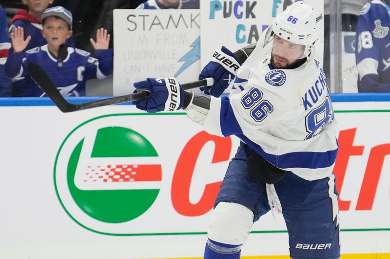 Nov 6, 2023; Toronto, Ontario, CAN; Tampa Bay Lightning forward Nikita Kucherov (86) shoots the puck during warm up before a gmae against the Toronto Maple Leafs at Scotiabank Arena. Mandatory Credit: John E. Sokolowski-USA TODAY Sports