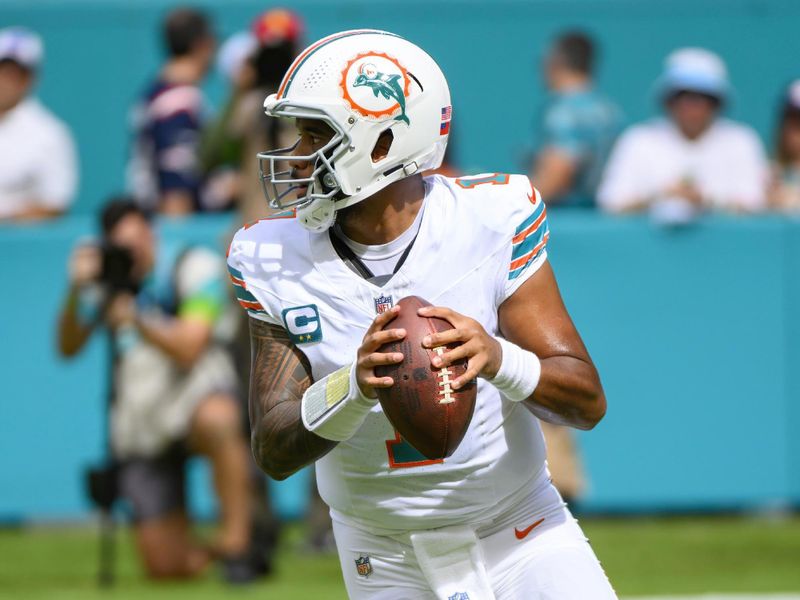 Miami Dolphins quarterback Tua Tagovailoa (1) looks to throw the ball during an NFL football game against the New England Patriots, Sunday, Oct. 29, 2023, in Miami Gardens, Fla. (AP Photo/Doug Murray)