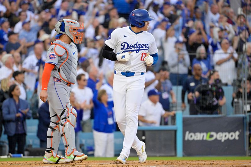Oct 20, 2024; Los Angeles, California, USA; Los Angeles Dodgers designated hitter Shohei Ohtani (17) scores on a double by shortstop Tommy Edman (not pictured) in the first inning against the New York Mets during game six of the NLCS for the 2024 MLB playoffs at Dodger Stadium. Mandatory Credit: Jayne Kamin-Oncea-Imagn Images
