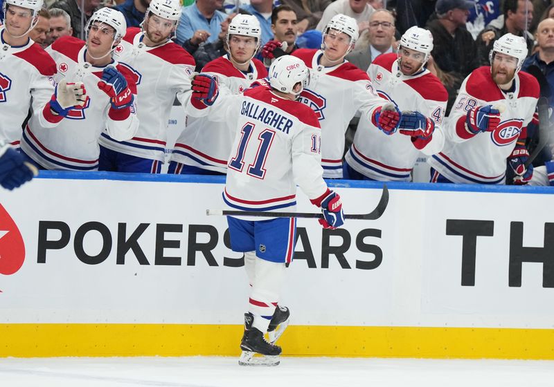 Nov 9, 2024; Toronto, Ontario, CAN; Montreal Canadiens right wing Brendan Gallagher (11) celebrates at the bench after scoring a goal against the Toronto Maple Leafs during the second period at Scotiabank Arena. Mandatory Credit: Nick Turchiaro-Imagn Images