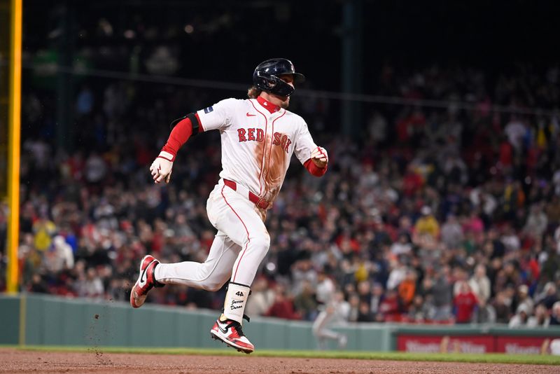 May 1, 2024; Boston, Massachusetts, USA; Boston Red Sox center fielder Jarren Duran (16) runs to third base after hitting an RBI during the fourth inning against the San Francisco Giants at Fenway Park. Mandatory Credit: Eric Canha-USA TODAY Sports