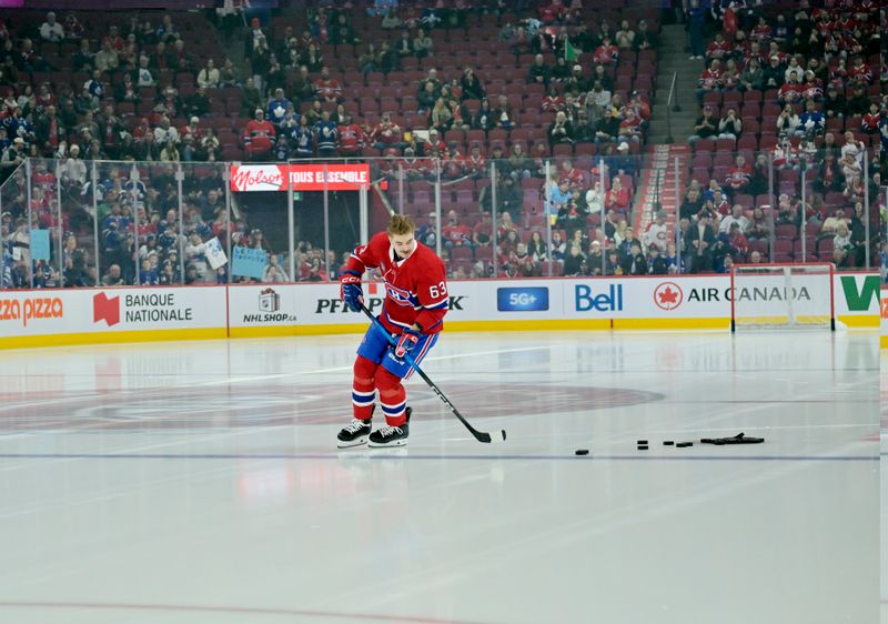 Nov 22, 2025; Montreal, Quebec, CAN; Montreal Canadiens forward Florian Xhekaj (63) skates a rookie lap during the warmup before the game against the Toronto Maple Leafs at the Bell Centre. Mandatory Credit: Eric Bolte-Imagn Images