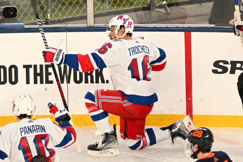 Feb 18, 2024; East Rutherford, New Jersey, USA;  New York Rangers center Vincent Trocheck (16) celebrates his goal against the New York Islanders during the second period in a Stadium Series ice hockey game at MetLife Stadium. Mandatory Credit: Dennis Schneidler-USA TODAY Sports