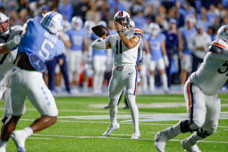 Oct 21, 2023; Chapel Hill, North Carolina, USA; Virginia Cavaliers quarterback Tony Muskett (11) passes against the North Carolina Tar Heels in the first half at Kenan Memorial Stadium. Mandatory Credit: Nell Redmond-USA TODAY Sports