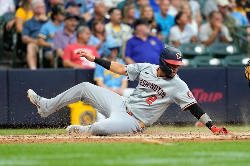 Jul 12, 2024; Milwaukee, Wisconsin, USA;  Washington Nationals second baseman Luis Garcia Jr. (2) scores a run during the fourth inning against the Milwaukee Brewers at American Family Field. Mandatory Credit: Jeff Hanisch-USA TODAY Sports