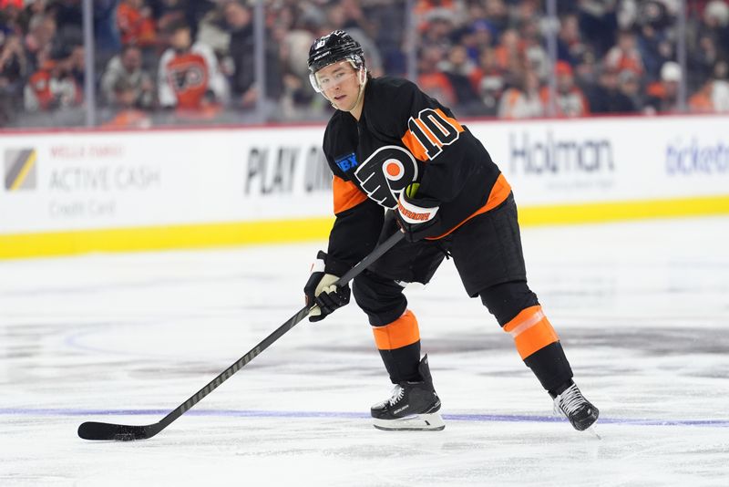 Apr 12, 2025; Philadelphia, Pennsylvania, USA; Philadelphia Flyers right wing Bobby Brink (10) controls the puck against the New York Islanders in the second period at Wells Fargo Center. Mandatory Credit: Kyle Ross-Imagn Images