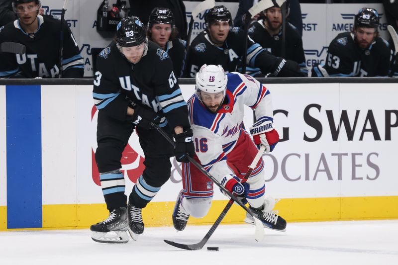 Jan 16, 2025; Salt Lake City, Utah, USA; New York Rangers center Vincent Trocheck (16) skates with the puck against Utah Hockey Club left wing Matias Maccelli (63) during the first period at Delta Center. Mandatory Credit: Rob Gray-Imagn Images