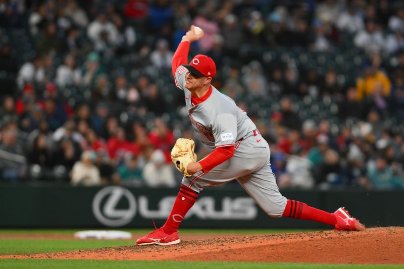 Apr 16, 2024; Seattle, Washington, USA; Cincinnati Reds relief pitcher Emilio Pagan (15) pitches to the Seattle Mariners during the fifth inning at T-Mobile Park. Mandatory Credit: Steven Bisig-USA TODAY Sports