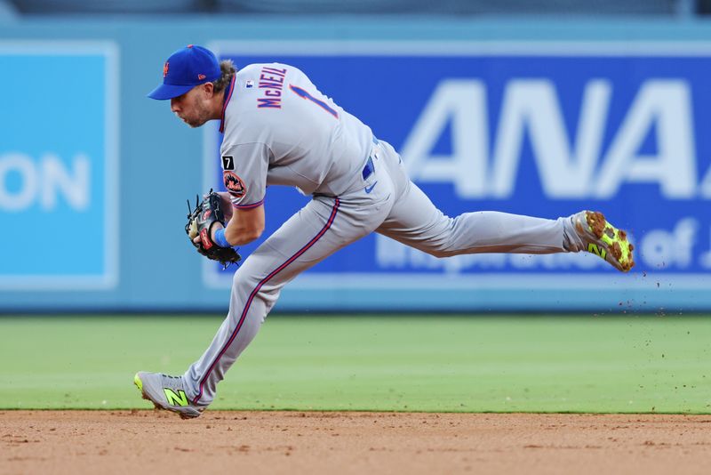 Jun 2, 2025; Los Angeles, California, USA; New York Mets second base Jeff McNeil (1) fields a grounder during the second inning against the Los Angeles Dodgers during the third inning against the New York Mets at Dodger Stadium. Mandatory Credit: Jason Parkhurst-Imagn Images