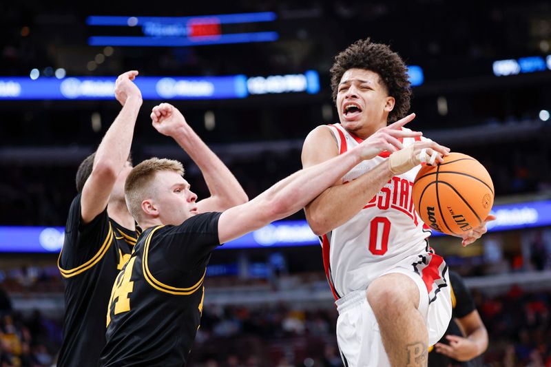 Mar 12, 2026; Chicago, IL, USA; Ohio State Buckeyes guard John Mobley Jr. (0) goes to the basket against Iowa Hawkeyes guard Bennett Stirtz (14) during the second half at United Center. Mandatory Credit: Kamil Krzaczynski-Imagn Images