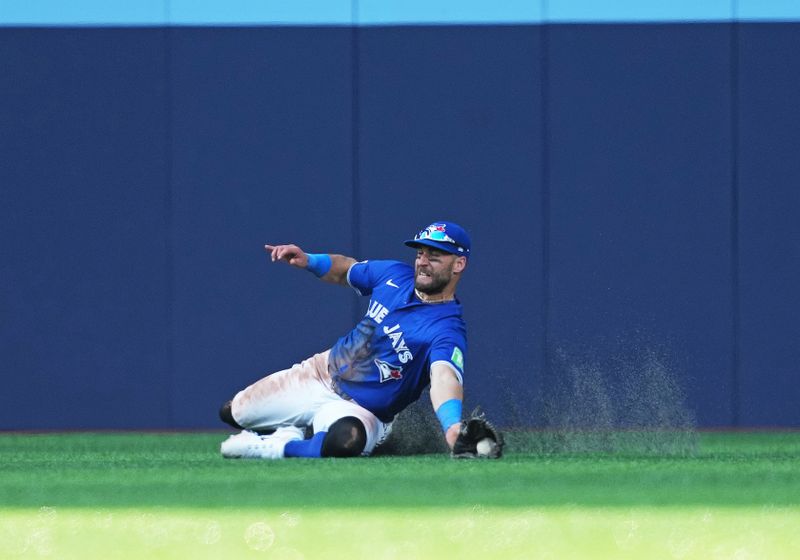 May 20, 2024; Toronto, Ontario, CAN; Toronto Blue Jays centre fielder Kevin Kiermaier (39) catches a fly ball for the final out against the Chicago White Sox during the ninth inning at Rogers Centre. Mandatory Credit: Nick Turchiaro-USA TODAY Sports