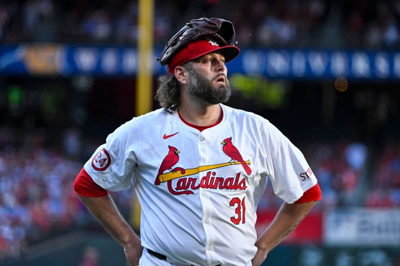 Jun 24, 2024; St. Louis, Missouri, USA;  St. Louis Cardinals starting pitcher Lance Lynn (31) looks on as he walks off the field after the second inning against the Atlanta Braves at Busch Stadium. Mandatory Credit: Jeff Curry-USA TODAY Sports