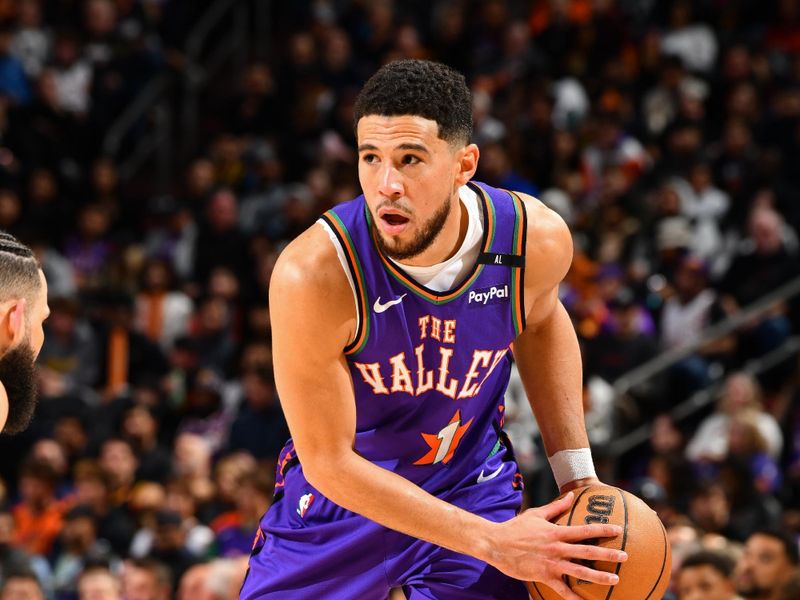 PHOENIX, AZ - JANUARY 12: Devin Booker #1 of the Phoenix Suns looks on during the game against the Charlotte Hornets on January 12, 2025 at Footprint Center in Phoenix, Arizona. NOTE TO USER: User expressly acknowledges and agrees that, by downloading and or using this photograph, user is consenting to the terms and conditions of the Getty Images License Agreement. Mandatory Copyright Notice: Copyright 2025 NBAE (Photo by Barry Gossage/NBAE via Getty Images)