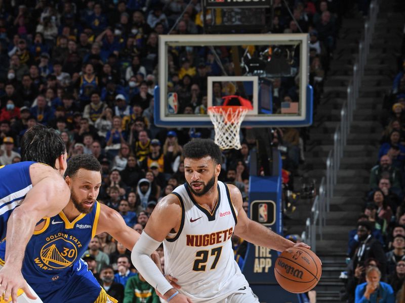 SAN FRANCISCO, CA - JANUARY 4: Jamal Murray #27 of the Denver Nuggets dribbles the ball during the game against the Golden State Warriors on January 4, 2024 at Chase Center in San Francisco, California. NOTE TO USER: User expressly acknowledges and agrees that, by downloading and or using this photograph, user is consenting to the terms and conditions of Getty Images License Agreement. Mandatory Copyright Notice: Copyright 2024 NBAE (Photo by Noah Graham/NBAE via Getty Images)