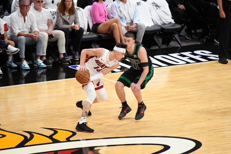 MIAMI, FL - APRIL 27: Tyler Herro #14 of the Miami Heat handles the ball during the game against the Boston Celtics during Round 1 Game 3 of the 2024 NBA Playoffs on April 27, 2024 at Kaseya Center in Miami, Florida. NOTE TO USER: User expressly acknowledges and agrees that, by downloading and or using this Photograph, user is consenting to the terms and conditions of the Getty Images License Agreement. Mandatory Copyright Notice: Copyright 2024 NBAE (Photo by Brian Babineau/NBAE via Getty Images)