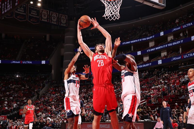 HOUSTON, TX - NOVEMBER 11: Alperen Sengun #28 of the Houston Rockets drives to the basket during the game against the Washington Wizards on November 11, 2024 at the Toyota Center in Houston, Texas. NOTE TO USER: User expressly acknowledges and agrees that, by downloading and or using this photograph, User is consenting to the terms and conditions of the Getty Images License Agreement. Mandatory Copyright Notice: Copyright 2024 NBAE (Photo by KeShawn Ennis/NBAE via Getty Images)