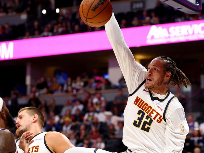 DENVER, COLORADO - OCTOBER 13: Aaron Gordon #32 of the Denver Nuggets dunks against the Phoenix Suns at Ball Arena on October 13, 2024 in Denver, Colorado. NOTE TO USER: User expressly acknowledges and agrees that, by downloading and/or using this Photograph, user is consenting to the terms and conditions of the Getty Images License Agreement. (Photo by Jamie Schwaberow/Getty Images)