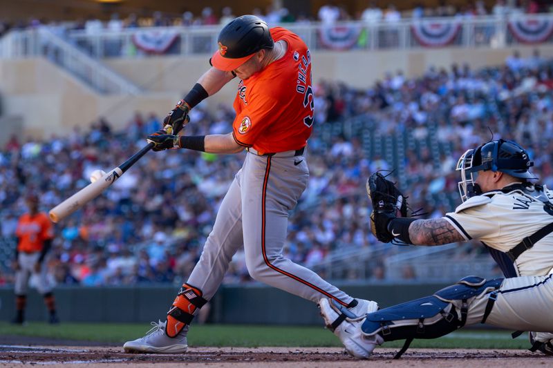 Sep 29, 2024; Minneapolis, Minnesota, USA; Baltimore Orioles right fielder Ryan O'Hearn (32) hits a single against the Minnesota Twins during the second inning at Target Field. Mandatory Credit: Matt Krohn-Imagn Images