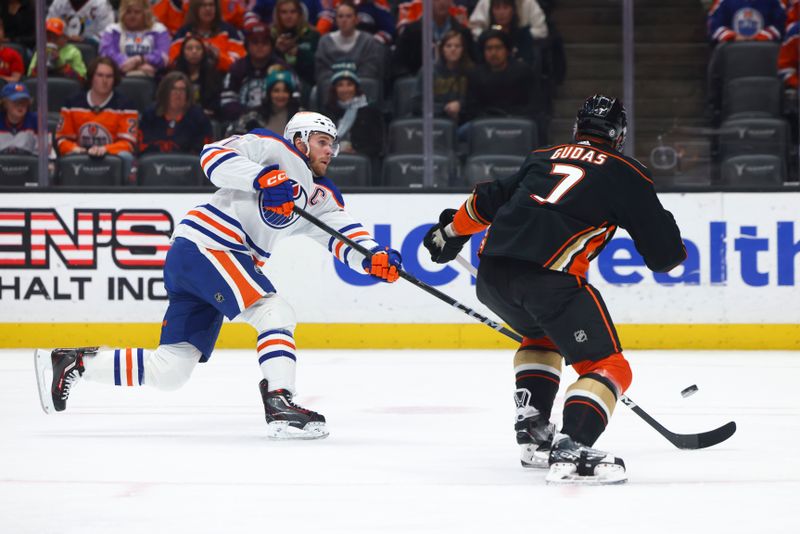 Feb 9, 2024; Anaheim, California, USA; Edmonton Oilers center Connor McDavid (97) shoots the puck against the Anaheim Ducks during the first period of a game at Honda Center. Mandatory Credit: Jessica Alcheh-USA TODAY Sports