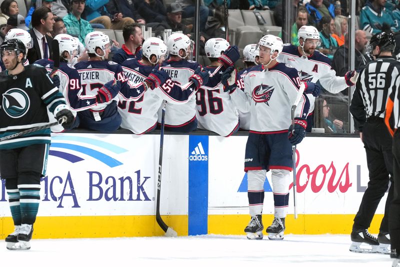 Feb 17, 2024; San Jose, California, USA; Columbus Blue Jackets left wing Dmitri Voronkov (10) is congratulated by teammates after scoring a goal against the San Jose Sharks during the second period at SAP Center at San Jose. Mandatory Credit: Darren Yamashita-USA TODAY Sports