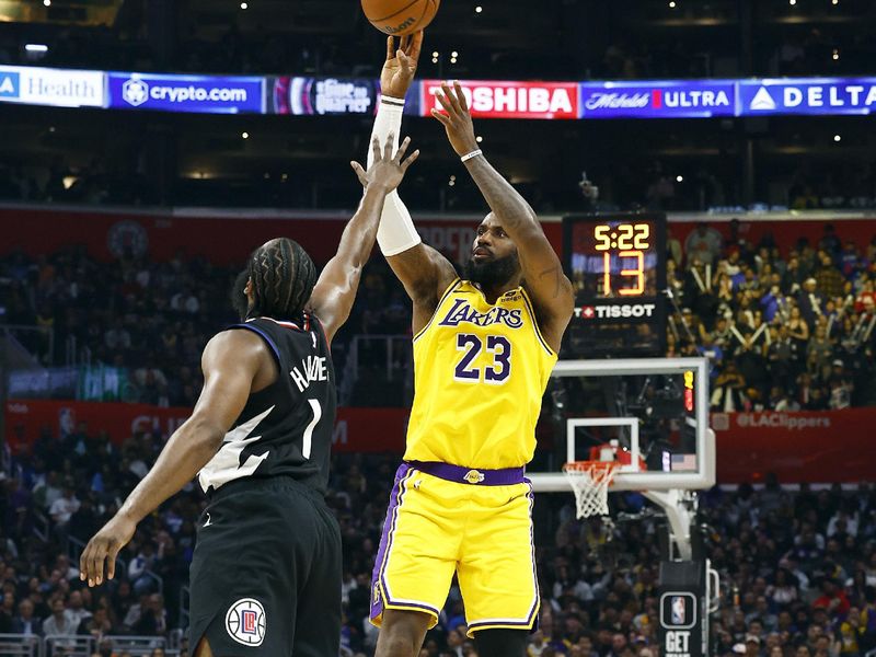 LOS ANGELES, CALIFORNIA - FEBRUARY 28:  LeBron James #23 of the Los Angeles Lakers takes a shot against Kawhi Leonard #2 of the LA Clippers in the second half at Crypto.com Arena on February 28, 2024 in Los Angeles, California.  NOTE TO USER: User expressly acknowledges and agrees that, by downloading and/or using this photograph, user is consenting to the terms and conditions of the Getty Images License Agreement.  (Photo by Ronald Martinez/Getty Images)