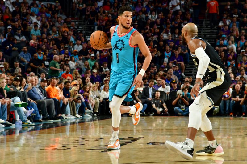 PHOENIX, AZ - MARCH 14: Devin Booker #1 of the Phoenix Suns dribbles the ball during the game against the Milwaukee Bucks on March 14, 2022 at Footprint Center in Phoenix, Arizona. NOTE TO USER: User expressly acknowledges and agrees that, by downloading and or using this photograph, user is consenting to the terms and conditions of the Getty Images License Agreement. Mandatory Copyright Notice: Copyright 2022 NBAE (Photo by Kate Frese/NBAE via Getty Images)