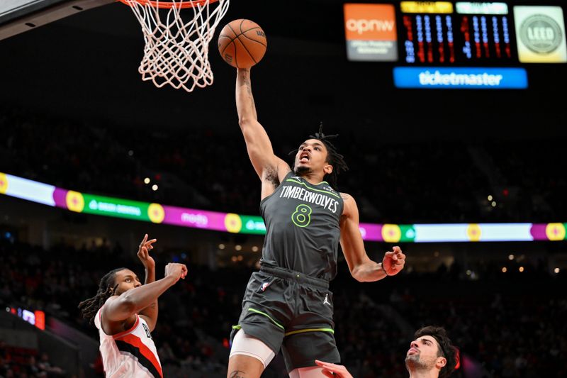 PORTLAND, OREGON - NOVEMBER 13: Josh Minott #8 of the Minnesota Timberwolves dunks during the first quarter of the game against the Portland Trail Blazers at Moda Center on November 13, 2024 in Portland, Oregon. NOTE TO USER: User expressly acknowledges and agrees that, by downloading and or using this photograph, User is consenting to the terms and conditions of the Getty Images License Agreement. (Photo by Alika Jenner/Getty Images)