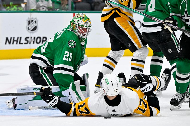 Mar 22, 2024; Dallas, Texas, USA; Pittsburgh Penguins right wing Bryan Rust (17) falls to the ice in front of Dallas Stars goaltender Jake Oettinger (29) during the first period at the American Airlines Center. Mandatory Credit: Jerome Miron-USA TODAY Sports