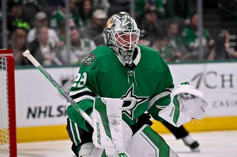 Jan 31, 2025; Dallas, Texas, USA; Dallas Stars goaltender Jake Oettinger (29) faces the Vancouver Canucks attack during the first period at the American Airlines Center. Mandatory Credit: Jerome Miron-Imagn Images