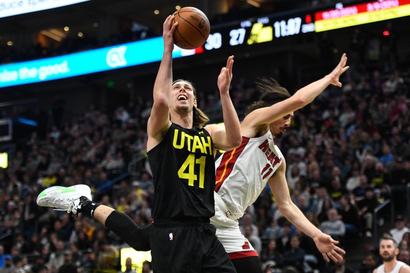 SALT LAKE CITY, UTAH - DECEMBER 30: Kelly Olynyk #41 of the Utah Jazz shoots in front of Jaime Jaquez Jr. #11 of the Miami Heat during the first half of a game at Delta Center on December 30, 2023 in Salt Lake City, Utah. NOTE TO USER: User expressly acknowledges and agrees that, by downloading and or using this photograph, User is consenting to the terms and conditions of the Getty Images License Agreement. (Photo by Alex Goodlett/Getty Images)