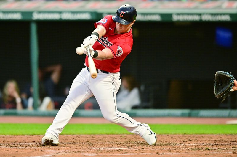 Sep 1, 2023; Cleveland, Ohio, USA; Cleveland Guardians first baseman Kole Calhoun (56) hits a sacrifice fly during the third inning against the Tampa Bay Rays at Progressive Field. Mandatory Credit: Ken Blaze-USA TODAY Sports