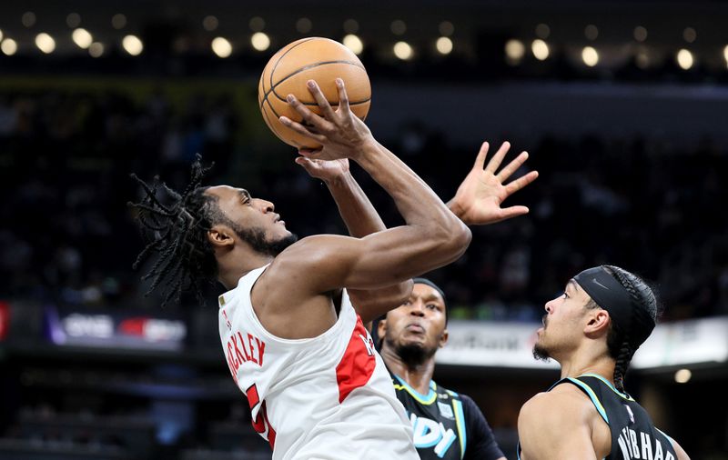 INDIANAPOLIS, INDIANA - FEBRUARY 26:   Immanuel Quickley #5 of the Toronto Raptors shoots the ball against the Indiana Pacers at Gainbridge Fieldhouse on February 26, 2024 in Indianapolis, Indiana.    NOTE TO USER: User expressly acknowledges and agrees that, by downloading and or using this photograph, User is consenting to the terms and conditions of the Getty Images License Agreement.  (Photo by Andy Lyons/Getty Images)