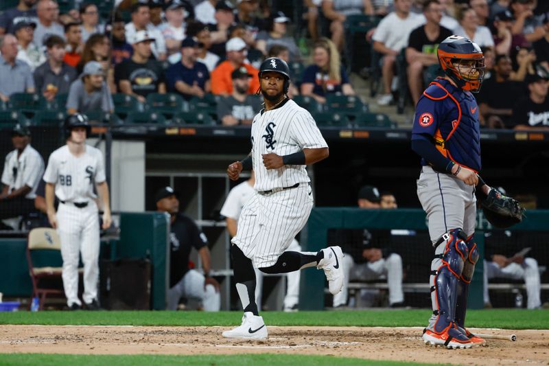 Jun 18, 2024; Chicago, Illinois, USA; Chicago White Sox outfielder Corey Julks (30) scores against the Houston Astros during the fifth inning at Guaranteed Rate Field. Mandatory Credit: Kamil Krzaczynski-USA TODAY Sports