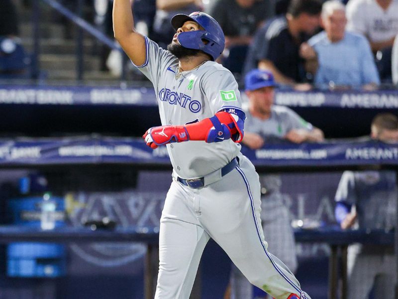 May 24, 2025; Tampa, Florida, USA; Toronto Blue Jays first baseman Vladimir Guerrero Jr. (27) runs the bases after hitting a solo home run against the Tampa Bay Rays in the sixth inning at George M. Steinbrenner Field. Mandatory Credit: Nathan Ray Seebeck-Imagn Images