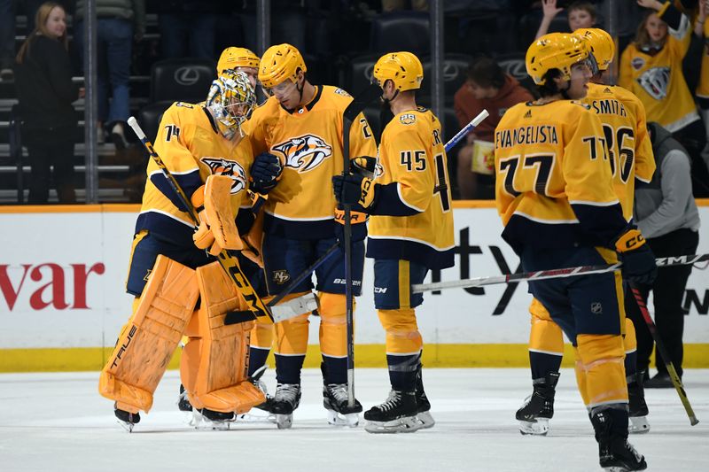 Mar 19, 2024; Nashville, Tennessee, USA; Nashville Predators goaltender Juuse Saros (74) celebrates with teammates after a win against the San Jose Sharks at Bridgestone Arena. Mandatory Credit: Christopher Hanewinckel-USA TODAY Sports