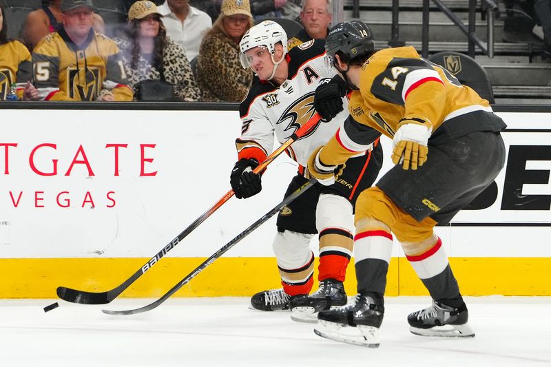 Apr 18, 2024; Las Vegas, Nevada, USA; Anaheim Ducks right wing Jakob Silfverberg (33) shoots against the stick of Vegas Golden Knights defenseman Nicolas Hague (14) during the first period at T-Mobile Arena. Mandatory Credit: Stephen R. Sylvanie-USA TODAY Sports