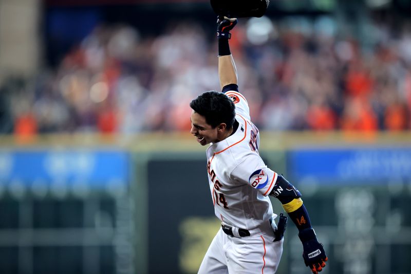 Sep 20, 2023; Houston, Texas, USA; Houston Astros center fielder Mauricio Dubon (14) reacts after hitting a walk off single against the Baltimore Orioles during the ninth inning at Minute Maid Park. Mandatory Credit: Erik Williams-USA TODAY Sports