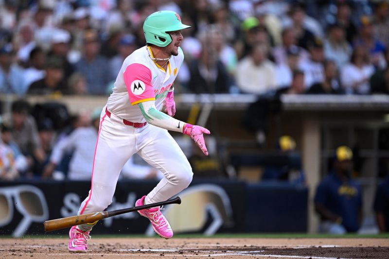 Jun 21, 2024; San Diego, California, USA; San Diego Padres center fielder Jackson Merrill (3) drives in a run on a fielder’s choice during the second inning against the Milwaukee Brewers at Petco Park. Mandatory Credit: Orlando Ramirez-USA TODAY Sports