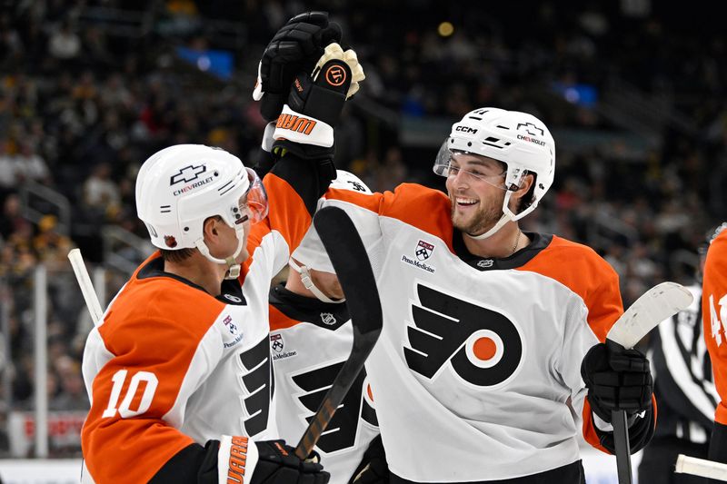 Sep 29, 2025; Boston, Massachusetts, USA;  Philadelphia Flyers forward Bobby Brink (10) and left wing Noah Cates (27) celebrate their assist on a goal against the Boston Bruins during the second period at TD Garden. Mandatory Credit: Eric Canha-Imagn Images
