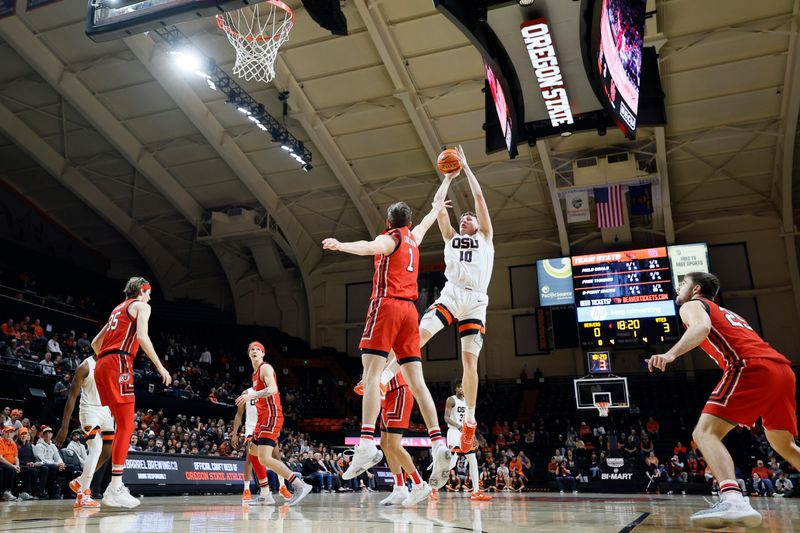 Jan 26, 2023; Corvallis, Oregon, USA; Oregon State Beavers forward Tyler Bilodeau (10) shoots the ball over Utah Utes forward Ben Carlson (1) during the first half at Gill Coliseum. Mandatory Credit: Soobum Im-USA TODAY Sports