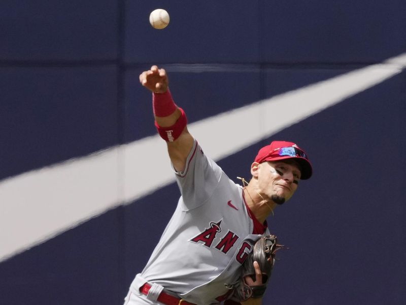 Jul 30, 2023; Toronto, Ontario, CAN; Los Angeles Angels shortstop Andrew Velazquez (4) throws out Toronto Blue Jays first baseman Vladimir Guerrero Jr. (not pictured) at first base during the fifth inning at Rogers Centre. Mandatory Credit: John E. Sokolowski-USA TODAY Sports