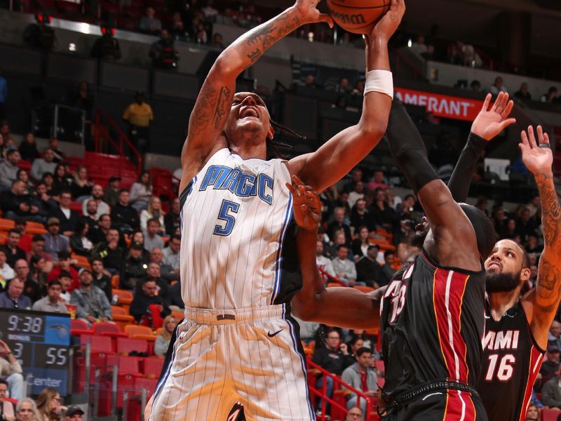 MIAMI, FL - FEBRUARY 6: Paolo Banchero #5 of the Orlando Magic shoots the ball during the game against the Miami Heat on February 6, 2024 at Kaseya Center in Miami, Florida. NOTE TO USER: User expressly acknowledges and agrees that, by downloading and or using this Photograph, user is consenting to the terms and conditions of the Getty Images License Agreement. Mandatory Copyright Notice: Copyright 2024 NBAE (Photo by Issac Baldizon/NBAE via Getty Images)