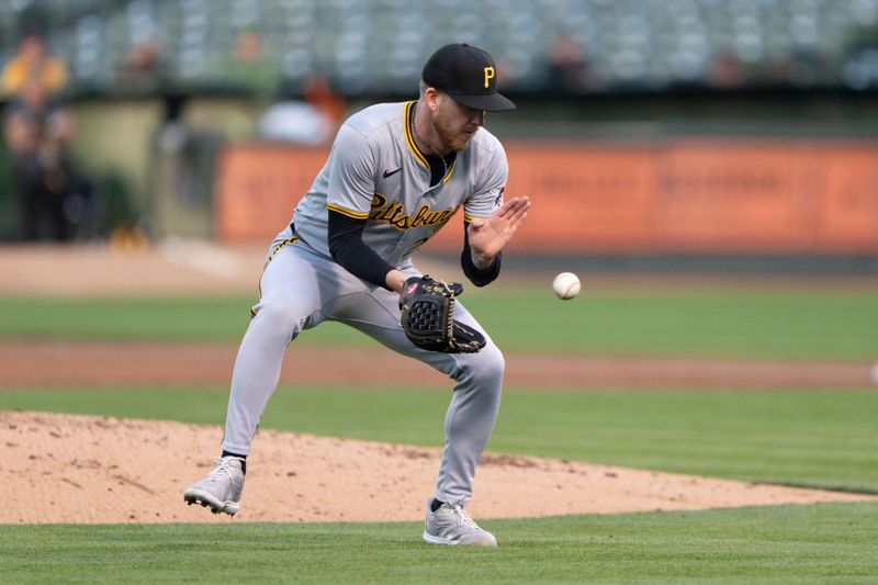 Apr 29, 2024; Oakland, California, USA; Pittsburgh Pirates pitcher Bailey Falter (26) catches the ball during the second inning against the Pittsburgh Pirates at Oakland-Alameda County Coliseum. Mandatory Credit: Stan Szeto-USA TODAY Sports